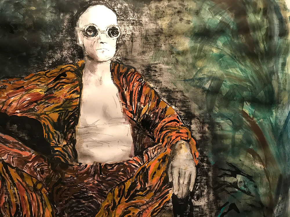 Portrait of a man dressed in tiger print clothing
